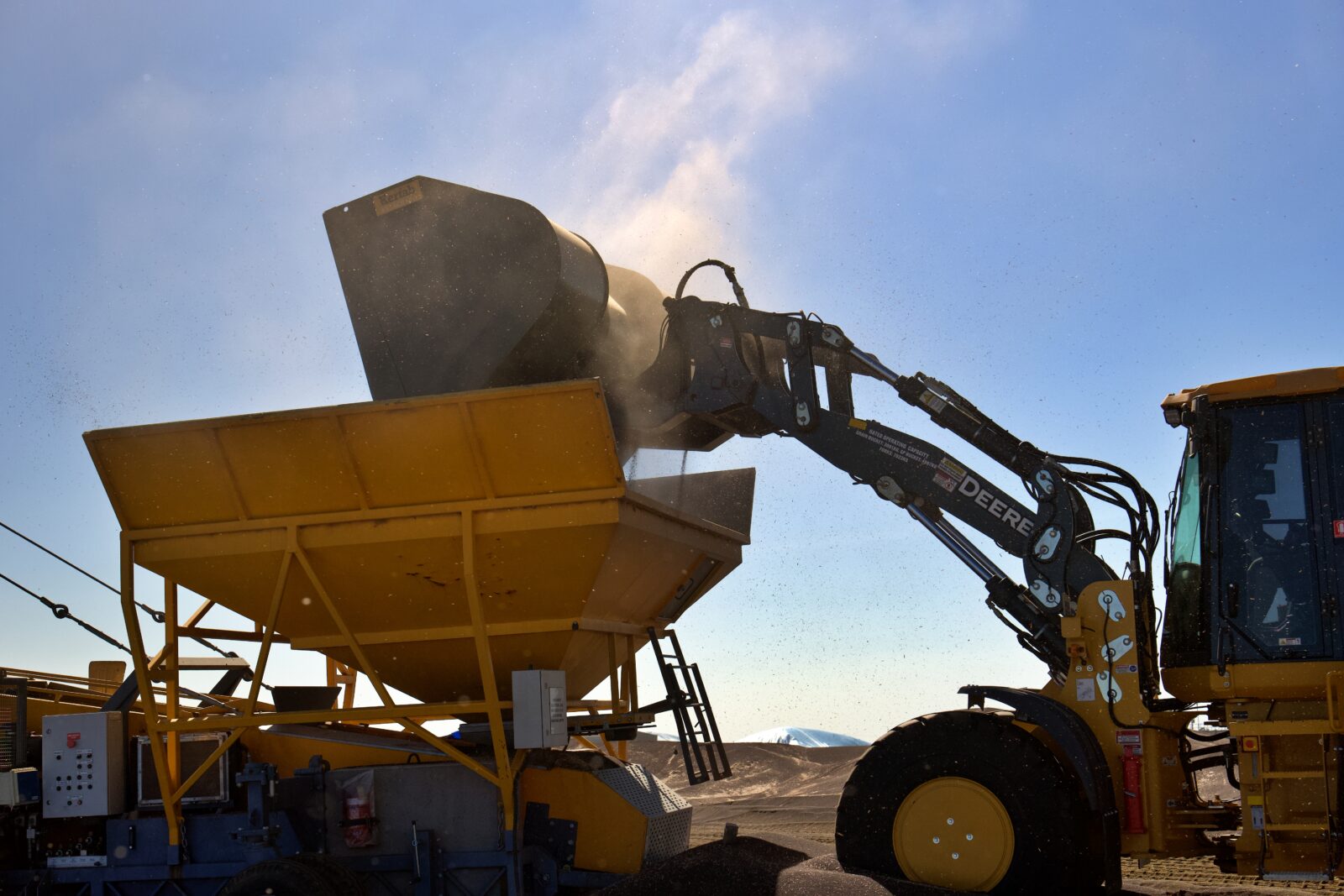 High Dump Bucket Kerfab high dump bucket fitted to loader, dumping material.